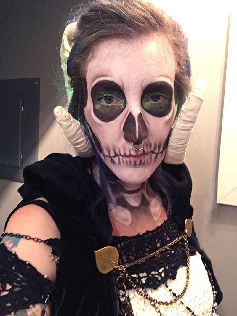 lich halloween makeup, stephanie has on skull makeup with green accents