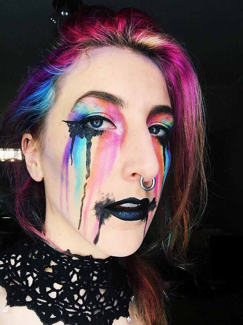 neon rainbows streak down from stephanie's eyes, with black dripping on top