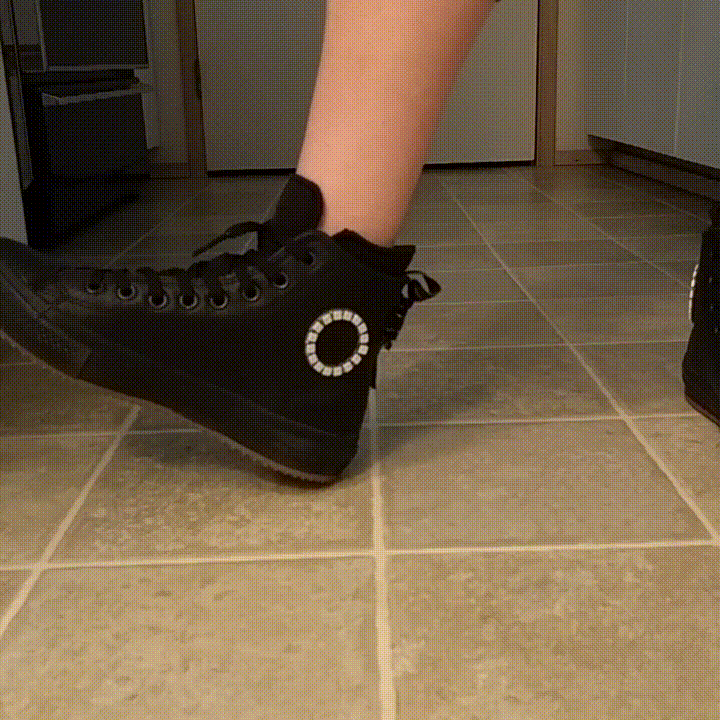 Black converse boots that have a ring of leds around the converse patch. When the shoe hits the ground the ring lights up in a pleasant wave animation.