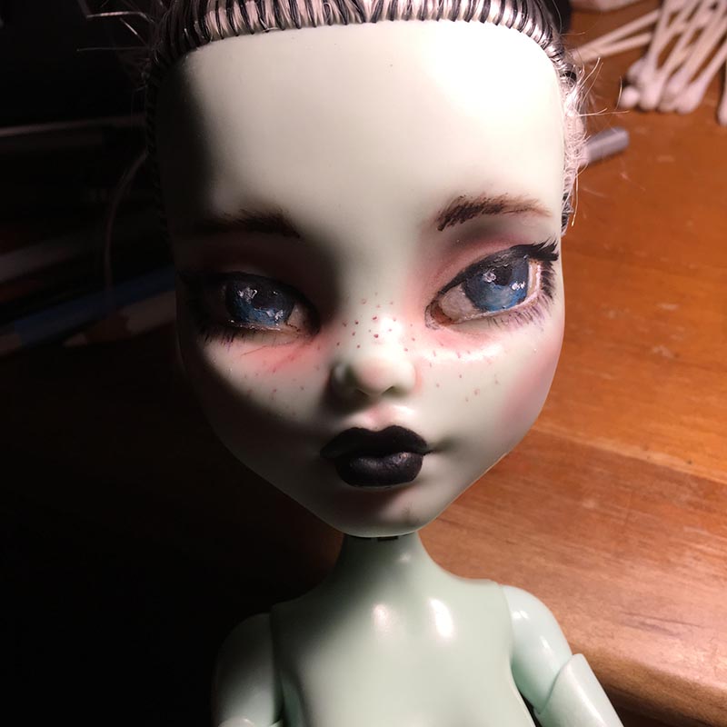 a monster high doll with a repainted face that looks more realistic than the original cartoony painting.