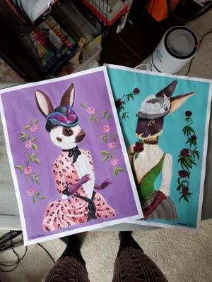 two anthropomorphic rabbits in victorian dress