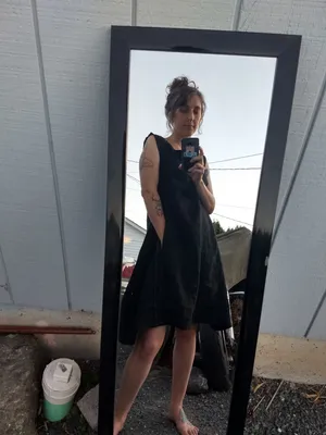 Simple black smock dress with hand sewn visible seams