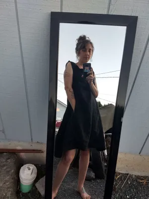 Simple black smock dress with hand sewn visible seams