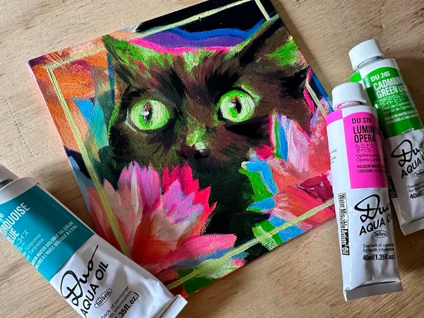 Oil cat next to Holbein Duo Aqua Oil tubes